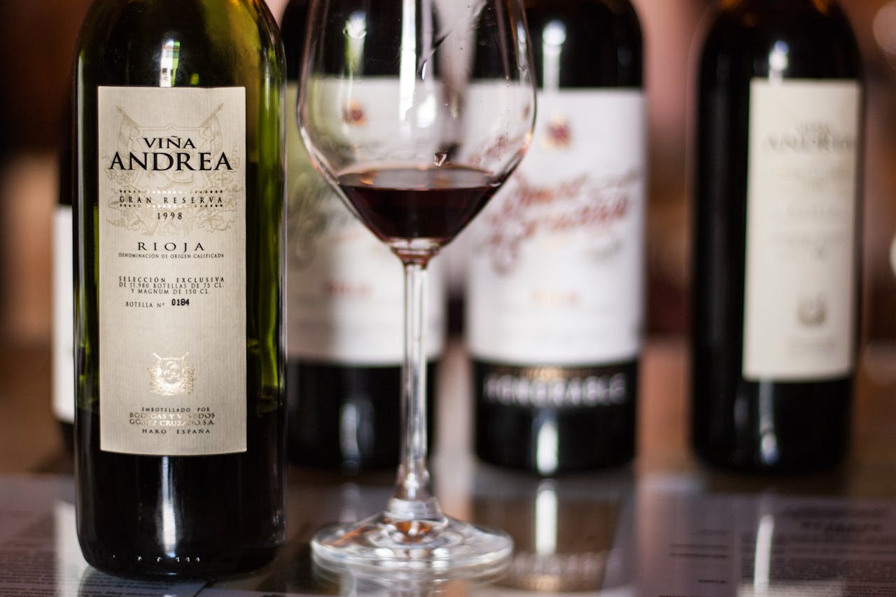 Close-up of Vina Andrea wine bottles in Rioja, Spain, featuring a glass of red wine.